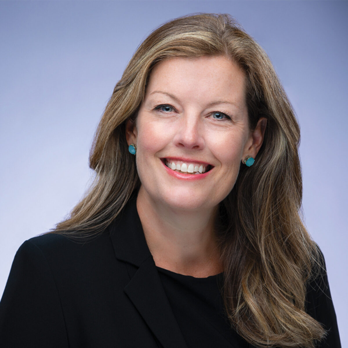 Stacy Schweikhart, Chief Executive Officer of Cradle to Career Network member Learn to Earn Dayton, smiles at the camera.
