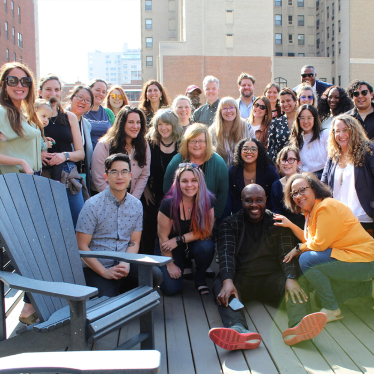 A group of StriveTogether staff members smile at the camera.